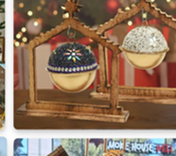 Custom metal décor manufacturer India — decorated hanging ornaments on a wooden frame